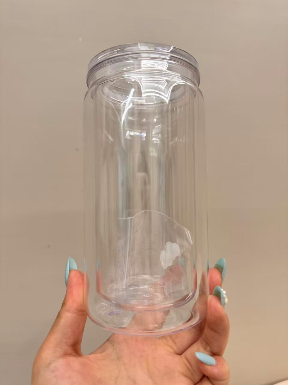 16oz double-wall plastic or glass tumbler with bottom plug, shatter-resistant straw cup.